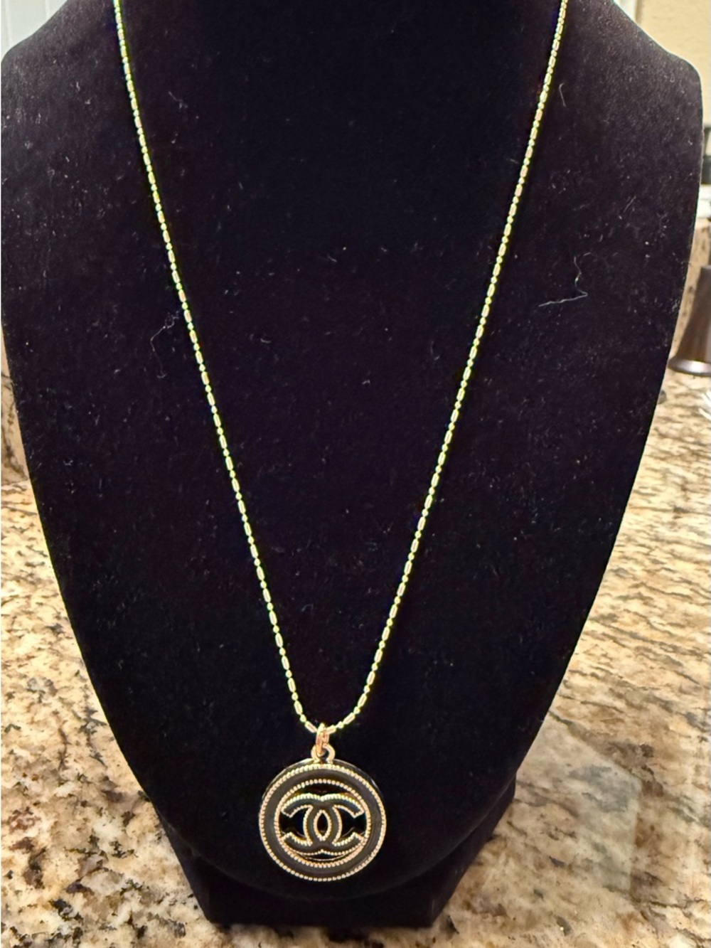 Authentic Chanel charm on gold filled chain not gold plated.